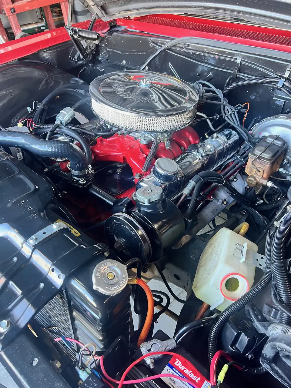 Red V8 with chrome valve covers and Edelbrock air cleaner